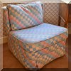 F53. Checkered slipper chair. 